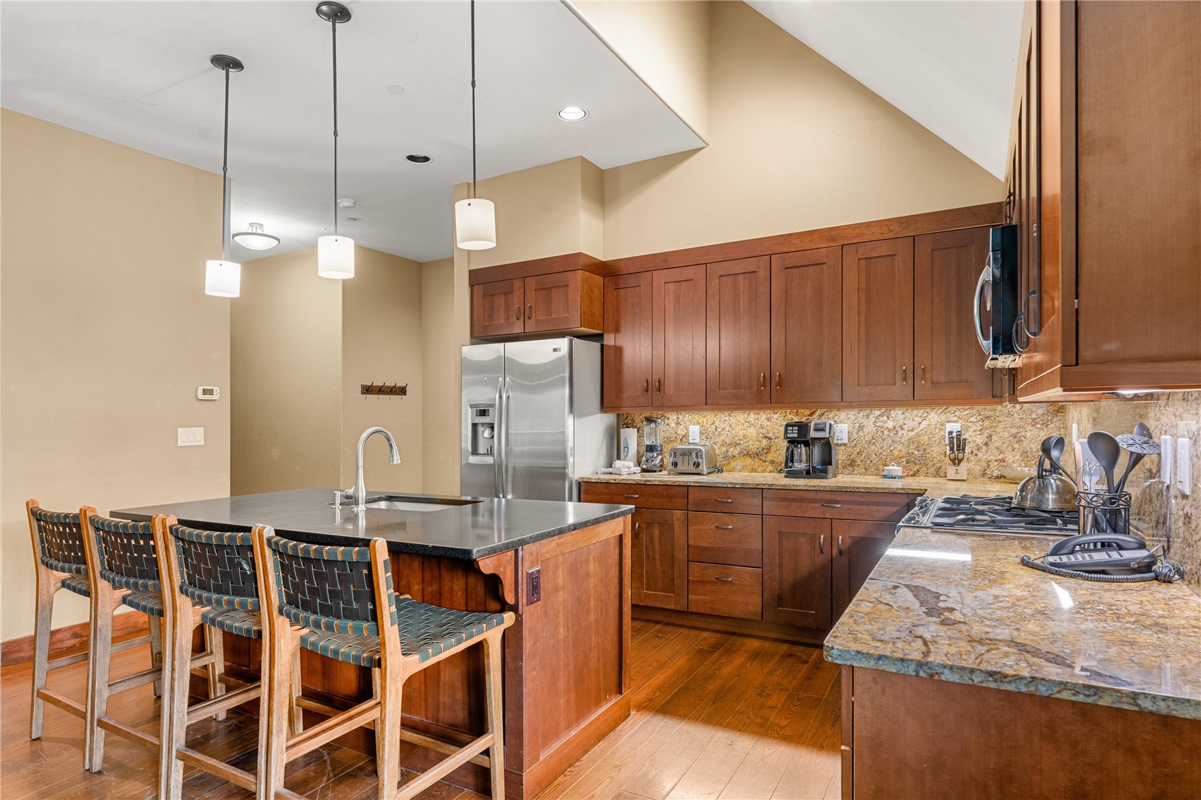 600 Columbine Road, Unit 5310 Breckenridge, CO 80424 - Photo 9 of 38 a kitchen with granite countertop a sink a counter space appliances and cabinets