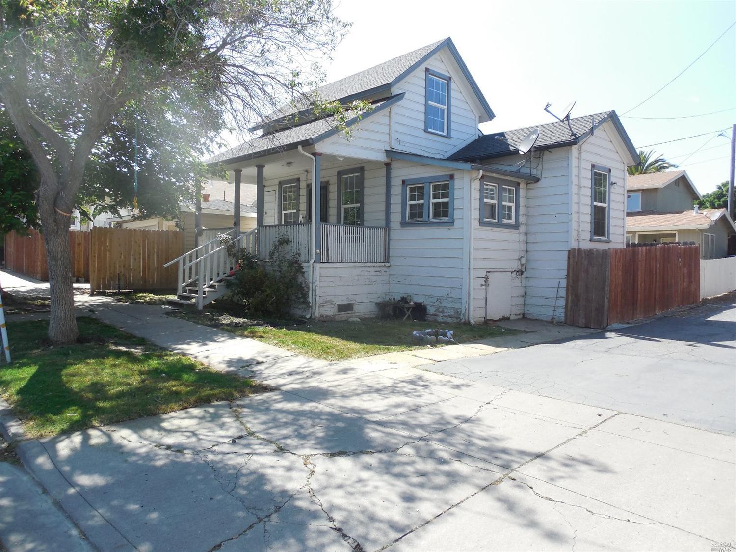 28 South 4th Street Rio Vista, CA 94571 - Photo 1 of 1 a front view of a house with a yard and garage
