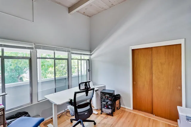 a view of a hallway with washer and dryer