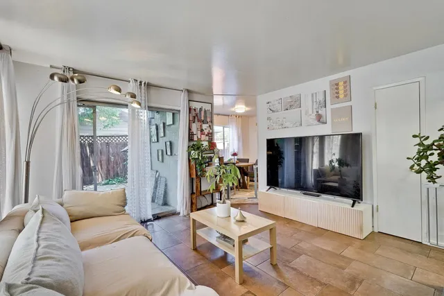 a kitchen with granite countertop stainless steel appliances stove microwave and cabinets