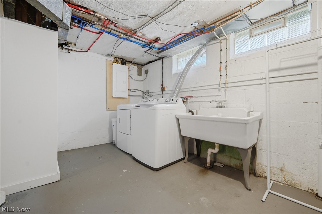 3722 Lindholm Road Shaker Heights, OH 44120 - Photo 32 of 34 Laundry area featuring a utility sink, washing machine, and dryer