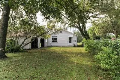 a house view with a backyard space