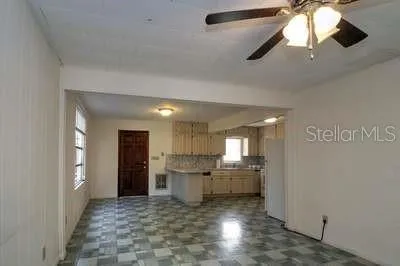 a view of a kitchen with a sink and cabinets