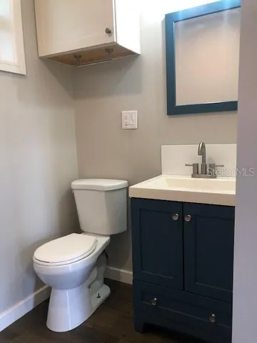 a bathroom with a shower and a toilet