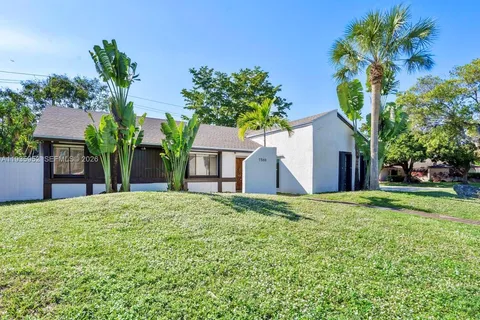 a house with garden in front of it