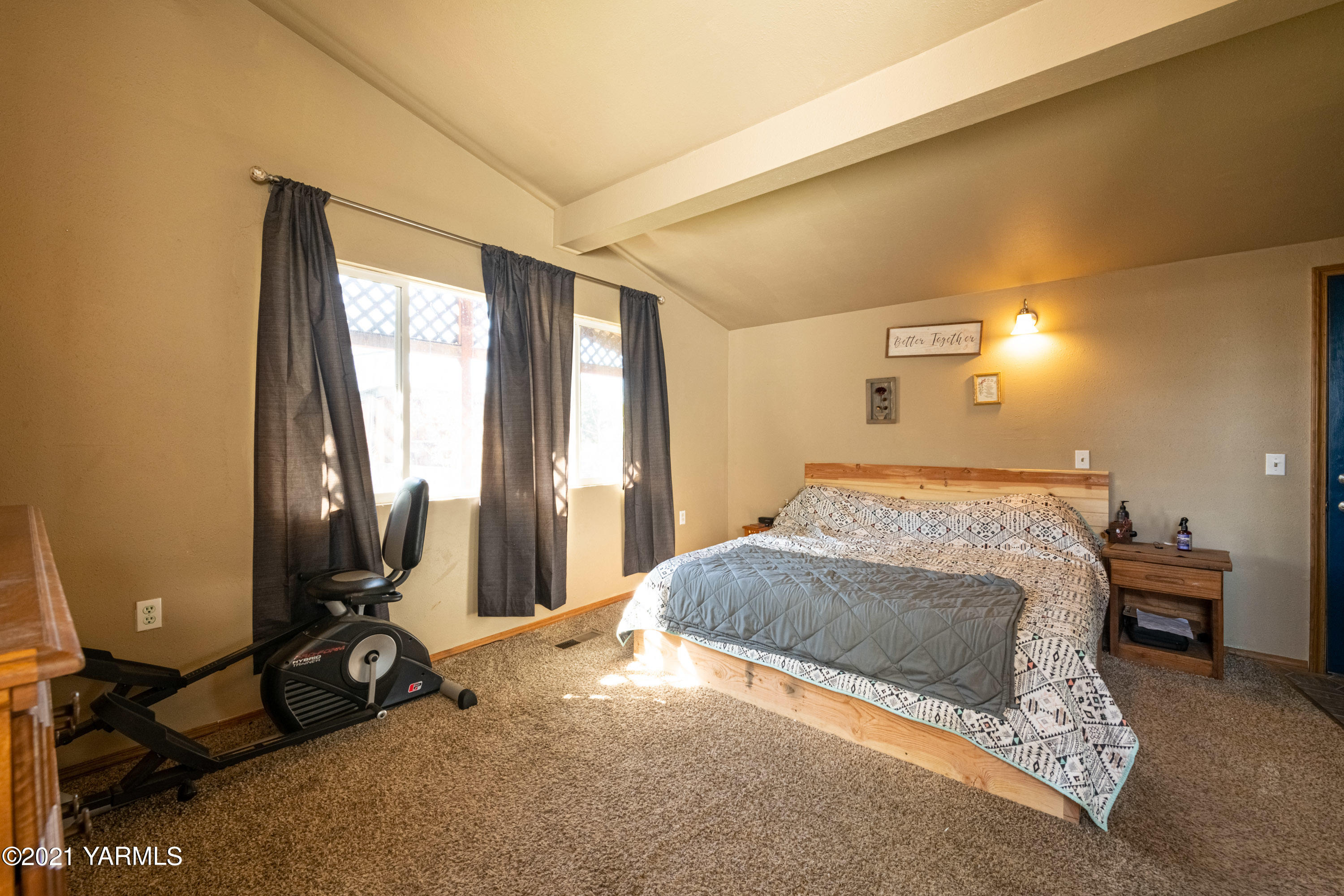 1222 Almo Road Yakima, WA 98901 - Photo 12 of 23 a bedroom with a bed window and a table in it