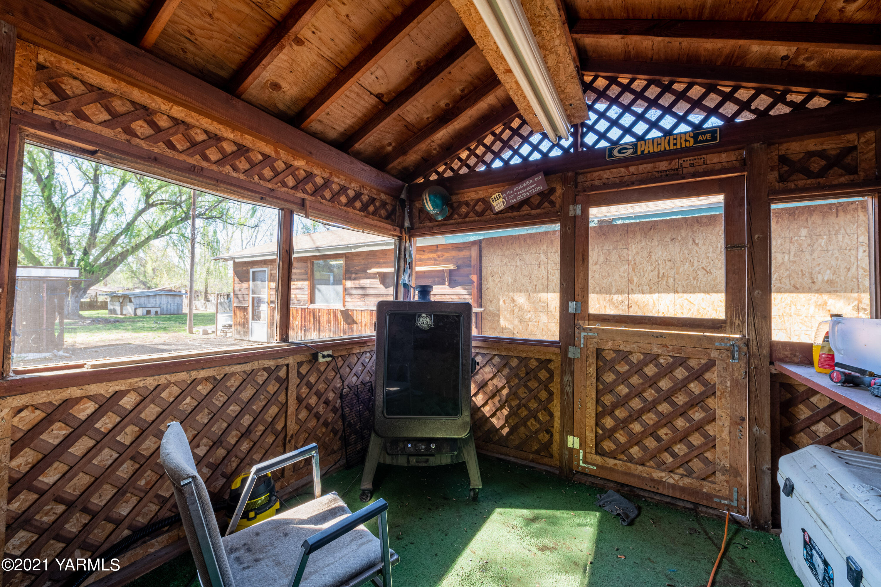 1222 Almo Road Yakima, WA 98901 - Photo 21 of 23 a view of a bedroom with wooden floor and balcony