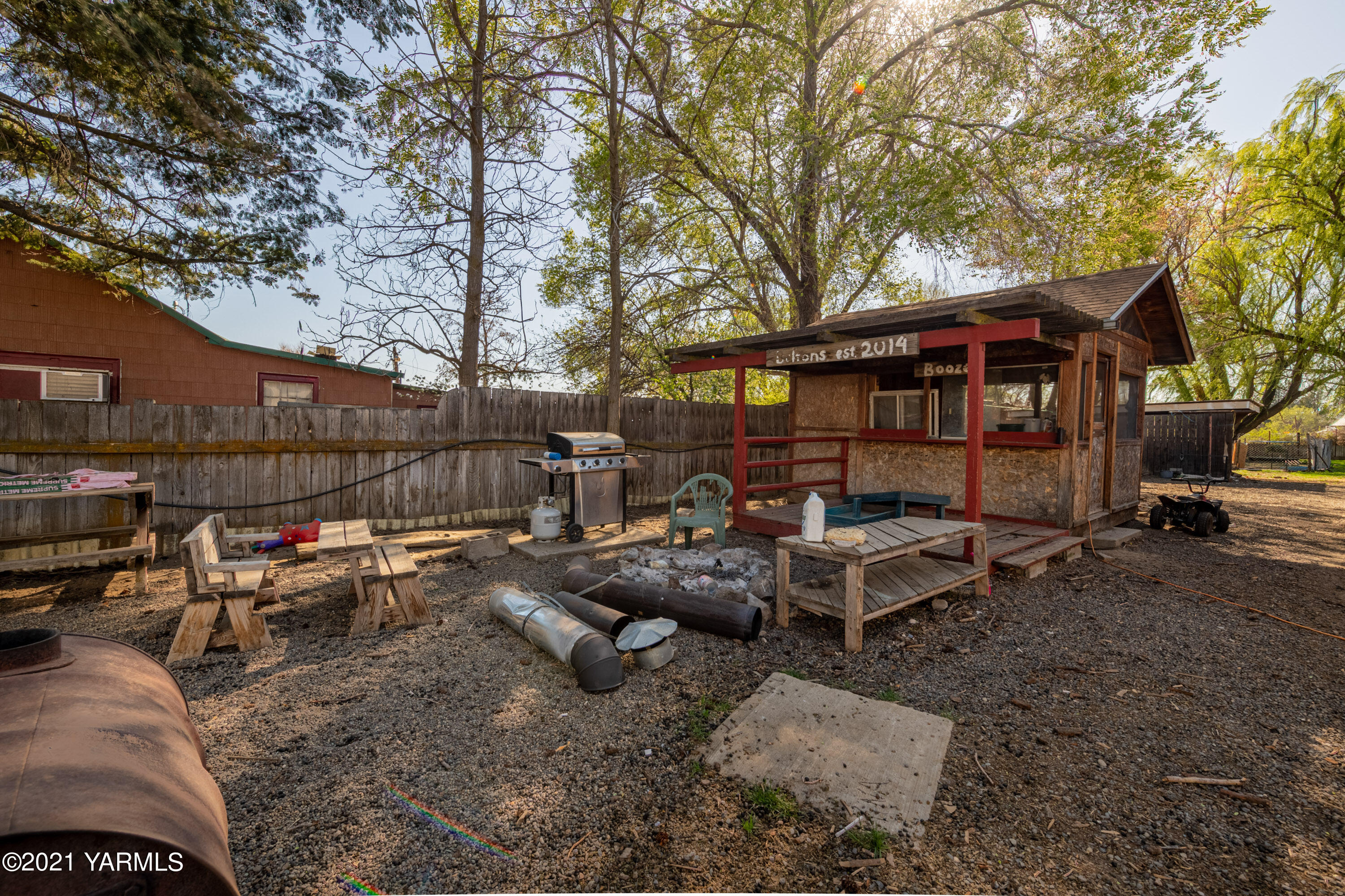 1222 Almo Road Yakima, WA 98901 - Photo 22 of 23 a view of backyard with outdoor seating and trees