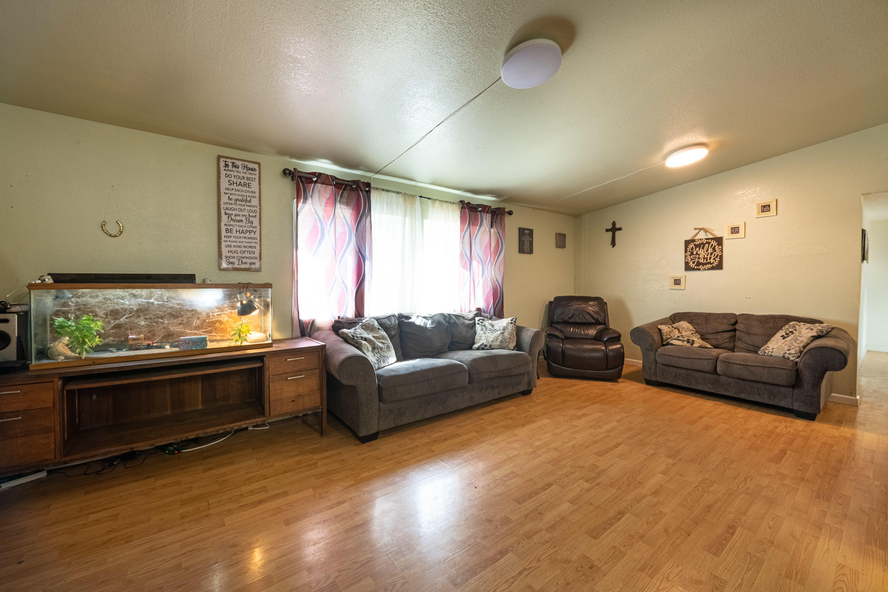 1222 Almo Road Yakima, WA 98901 - Photo 4 of 23 a living room with furniture fireplace and window