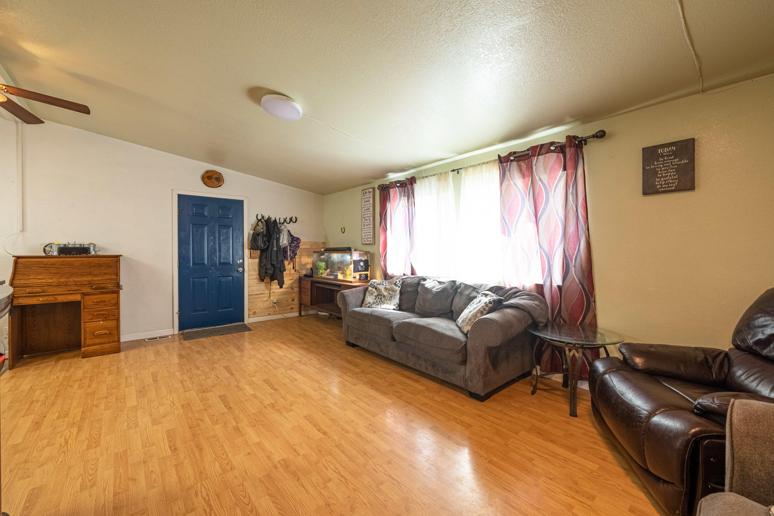 1222 Almo Road Yakima, WA 98901 - Photo 5 of 23 a living room with furniture and a flat screen tv