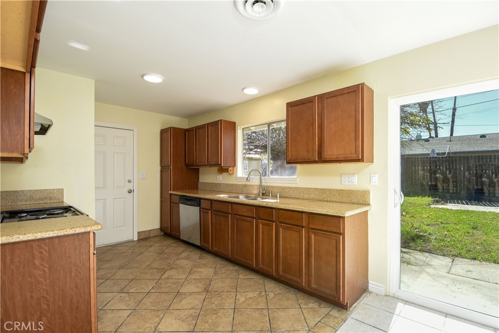 41431 Vicky Lane Hemet, CA 92544 - Photo 10 of 28 a kitchen with stainless steel appliances granite countertop a stove a sink and a microwave