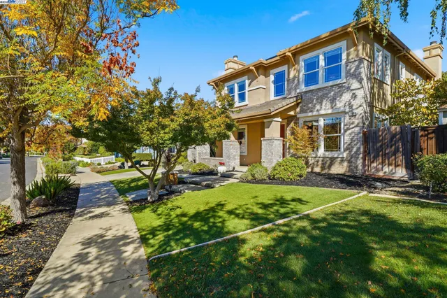 a front view of a house with garden
