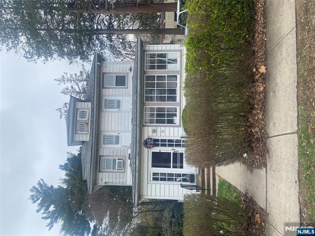 30 North Demarest Avenue Bergenfield, NJ 07621 - Photo 1 of 12 front view of a house with a yard
