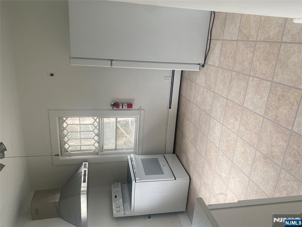 30 North Demarest Avenue Bergenfield, NJ 07621 - Photo 3 of 12 a view of an empty room with a window