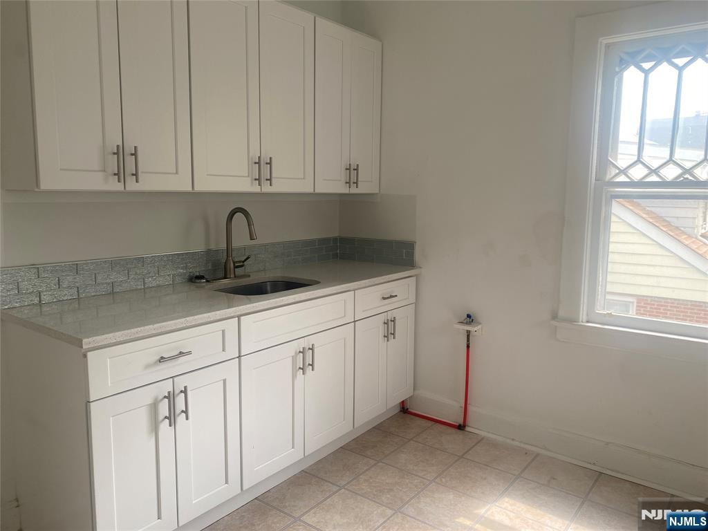 30 North Demarest Avenue Bergenfield, NJ 07621 - Photo 5 of 12 a kitchen with white cabinets