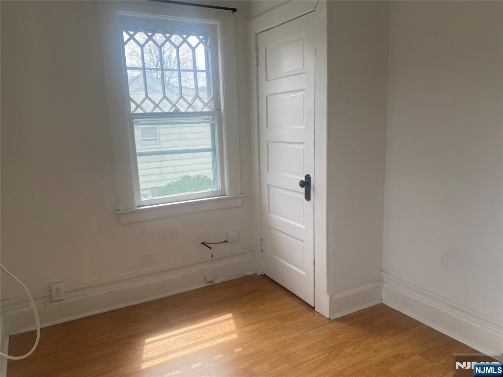 30 North Demarest Avenue Bergenfield, NJ 07621 - Photo 8 of 12 an empty room with windows