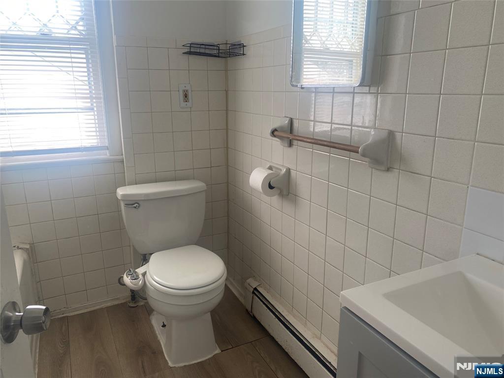 30 North Demarest Avenue Bergenfield, NJ 07621 - Photo 10 of 12 a white toilet sitting next to a bathroom sink