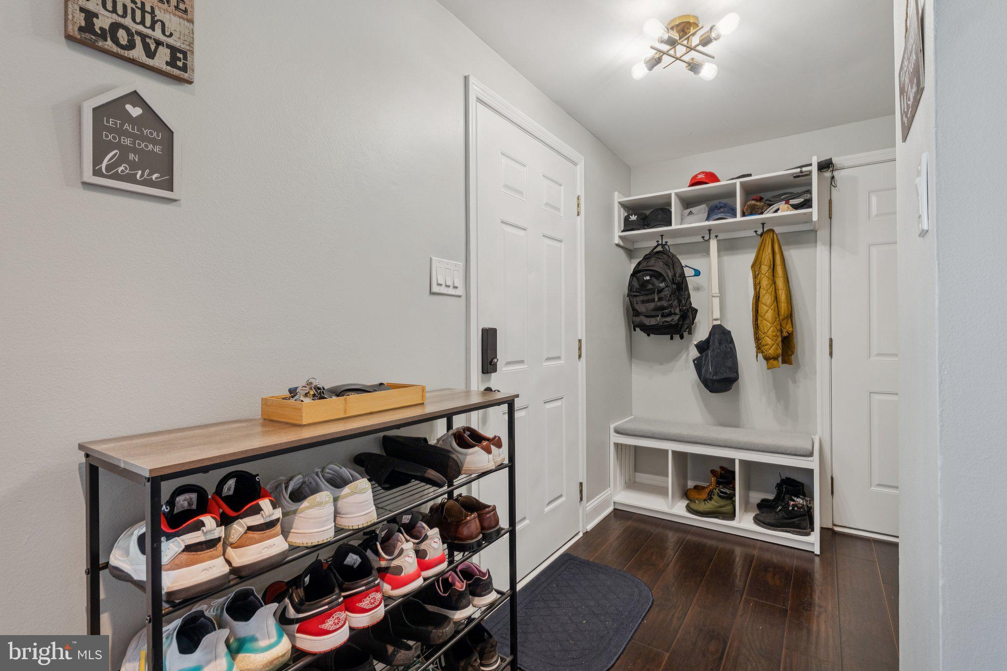 7310 Torran Rocks Way Gaithersburg, MD 20879 - Photo 3 of 26 a storage room with washer and dryer