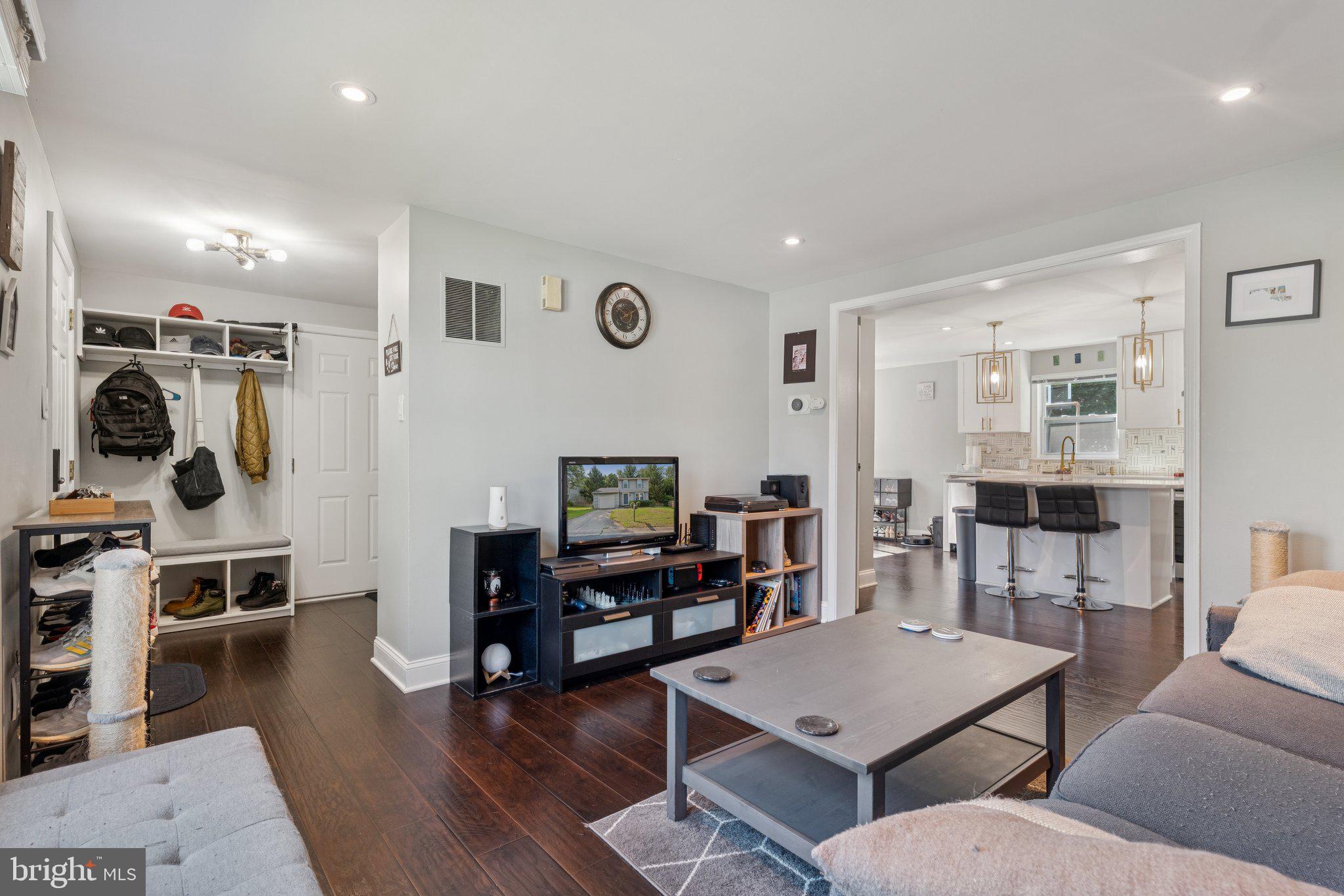 7310 Torran Rocks Way Gaithersburg, MD 20879 - Photo 6 of 26 a living room with furniture and wooden floor