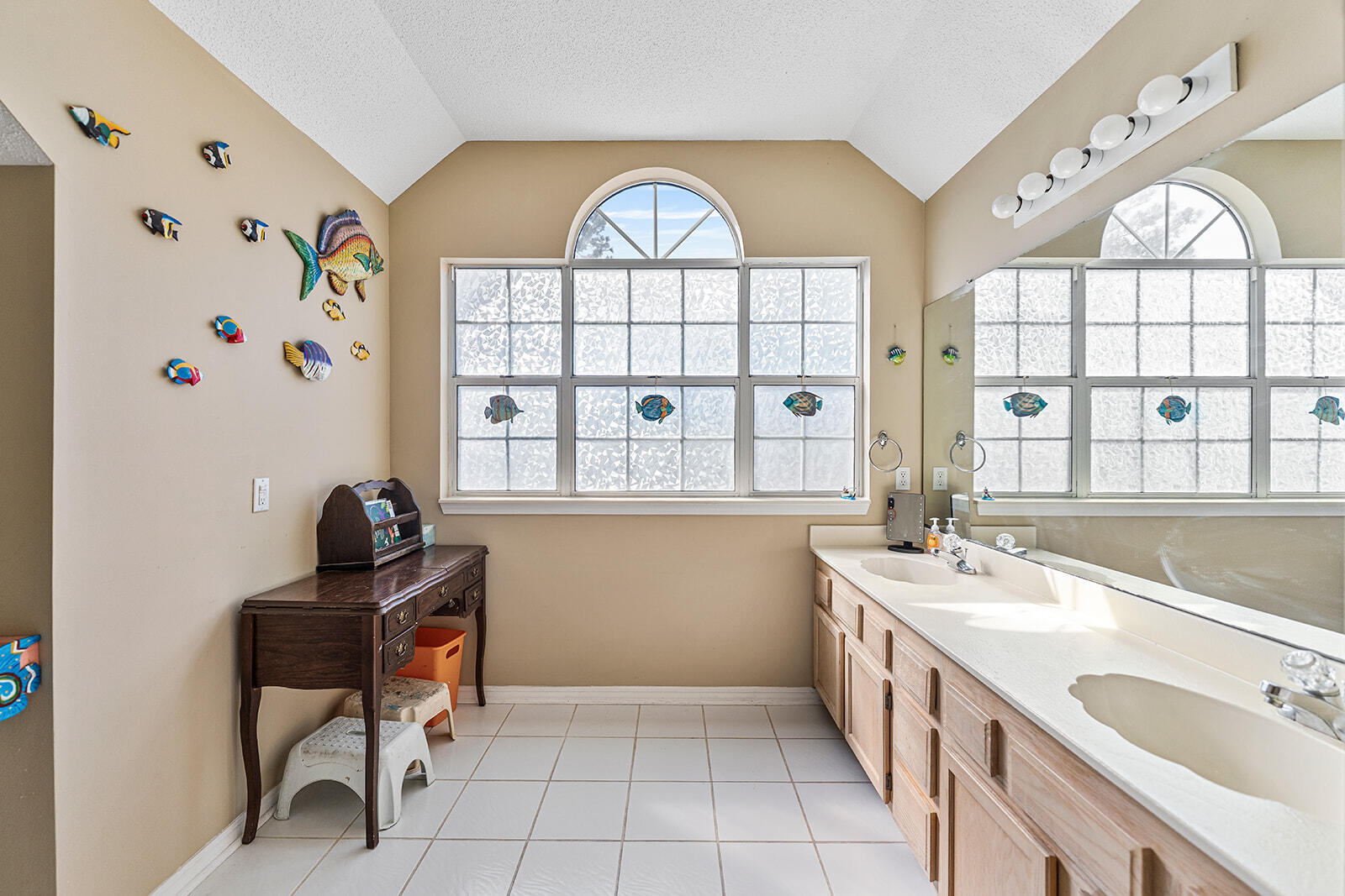132 Wedgewood Lane Crestview, FL 32536 - Photo 19 of 67 a bathroom with a sink a large mirror and a window
