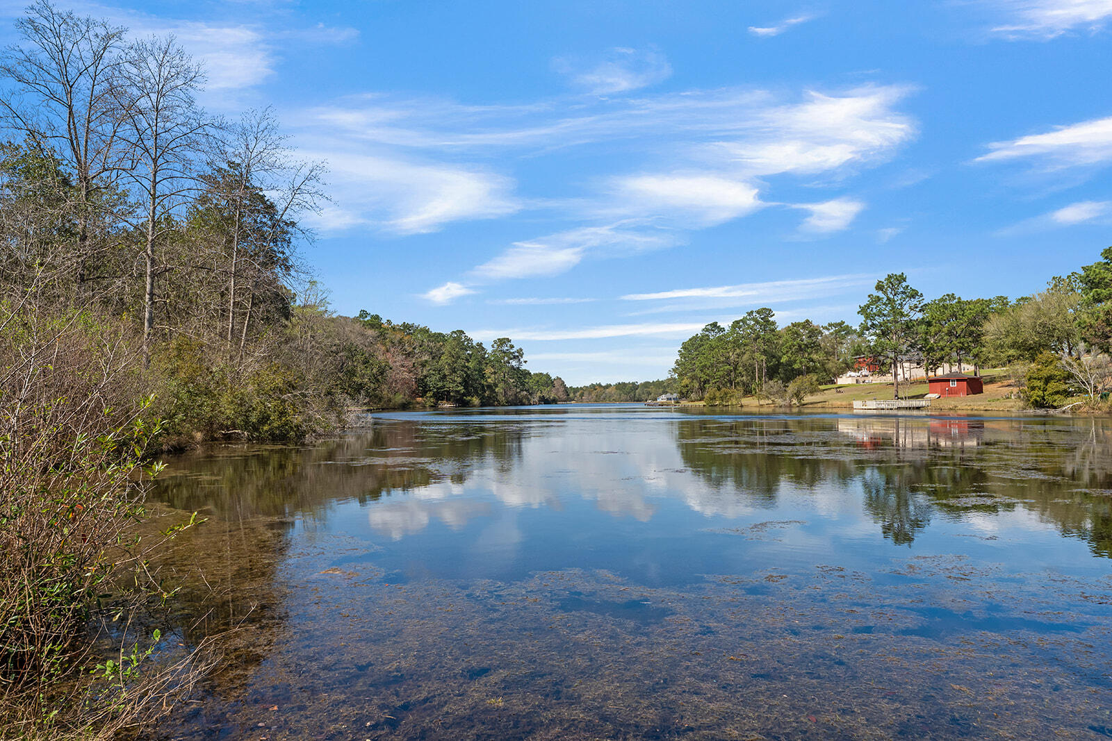 132 Wedgewood Lane Crestview, FL 32536 - Photo 2 of 67 a view of a lake with houses in the back