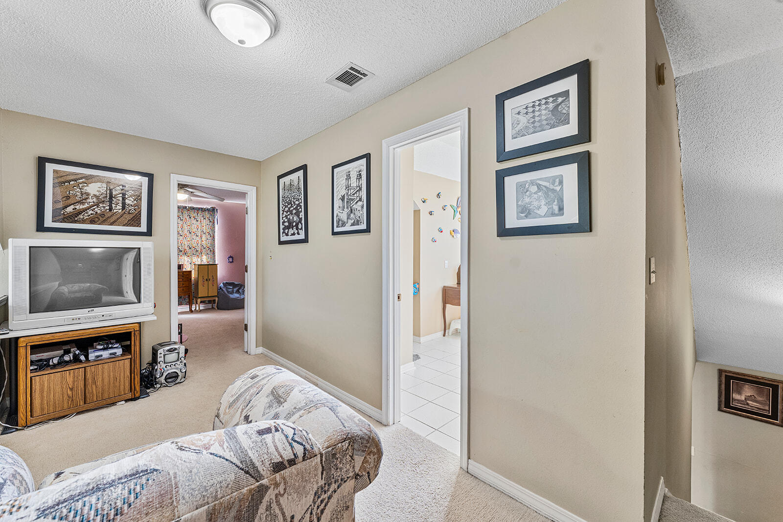 132 Wedgewood Lane Crestview, FL 32536 - Photo 24 of 67 a bedroom with a bed and a painting on the wall