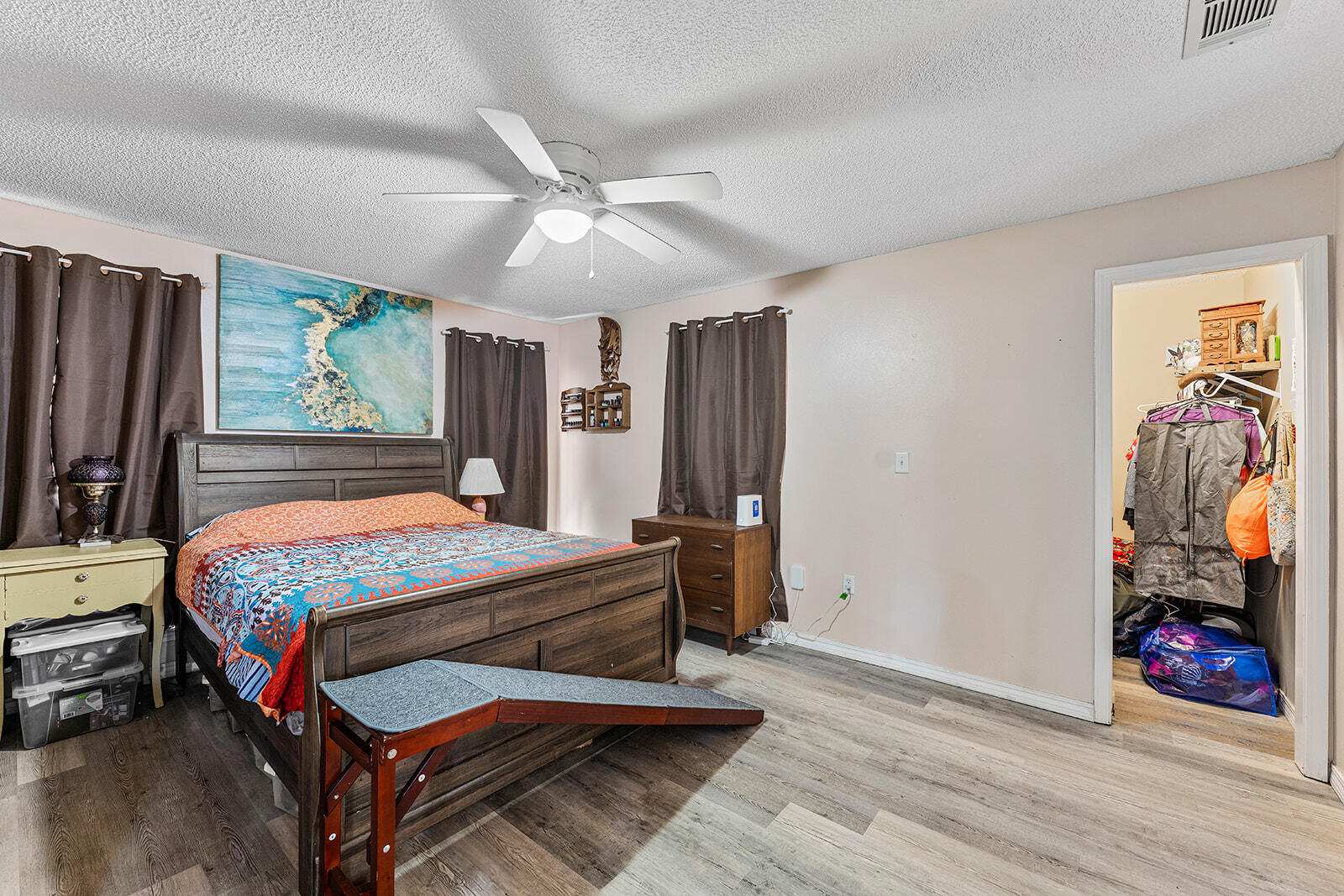 132 Wedgewood Lane Crestview, FL 32536 - Photo 30 of 67 a bedroom with a bed and wooden floor