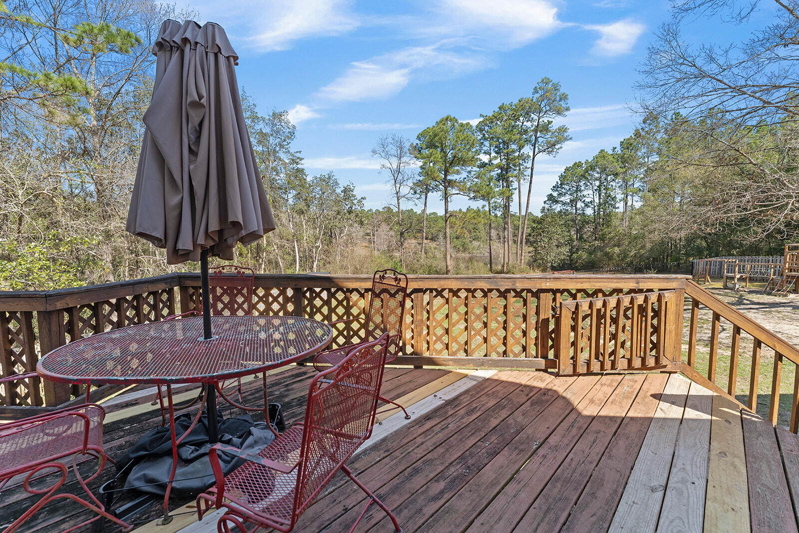 132 Wedgewood Lane Crestview, FL 32536 - Photo 37 of 67 a view of balcony with wooden floor and outdoor seating