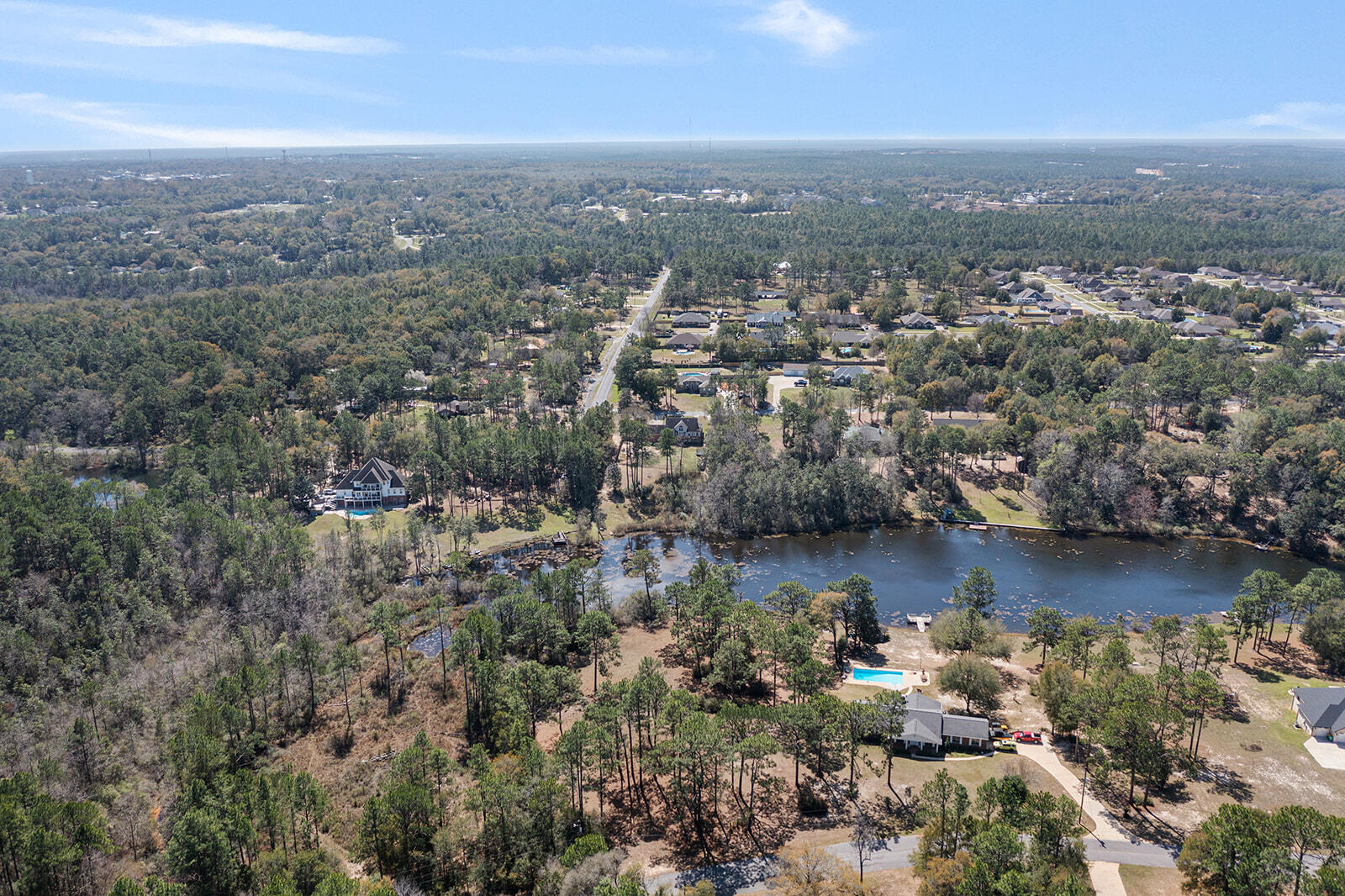 132 Wedgewood Lane Crestview, FL 32536 - Photo 60 of 67 an aerial view of a city with lots of residential buildings and ocean view