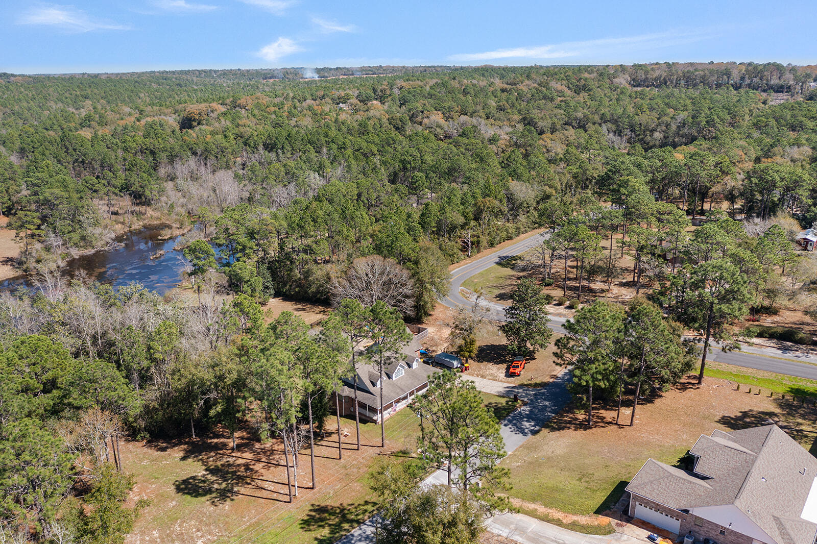132 Wedgewood Lane Crestview, FL 32536 - Photo 65 of 67 a view of a city with lush green forest