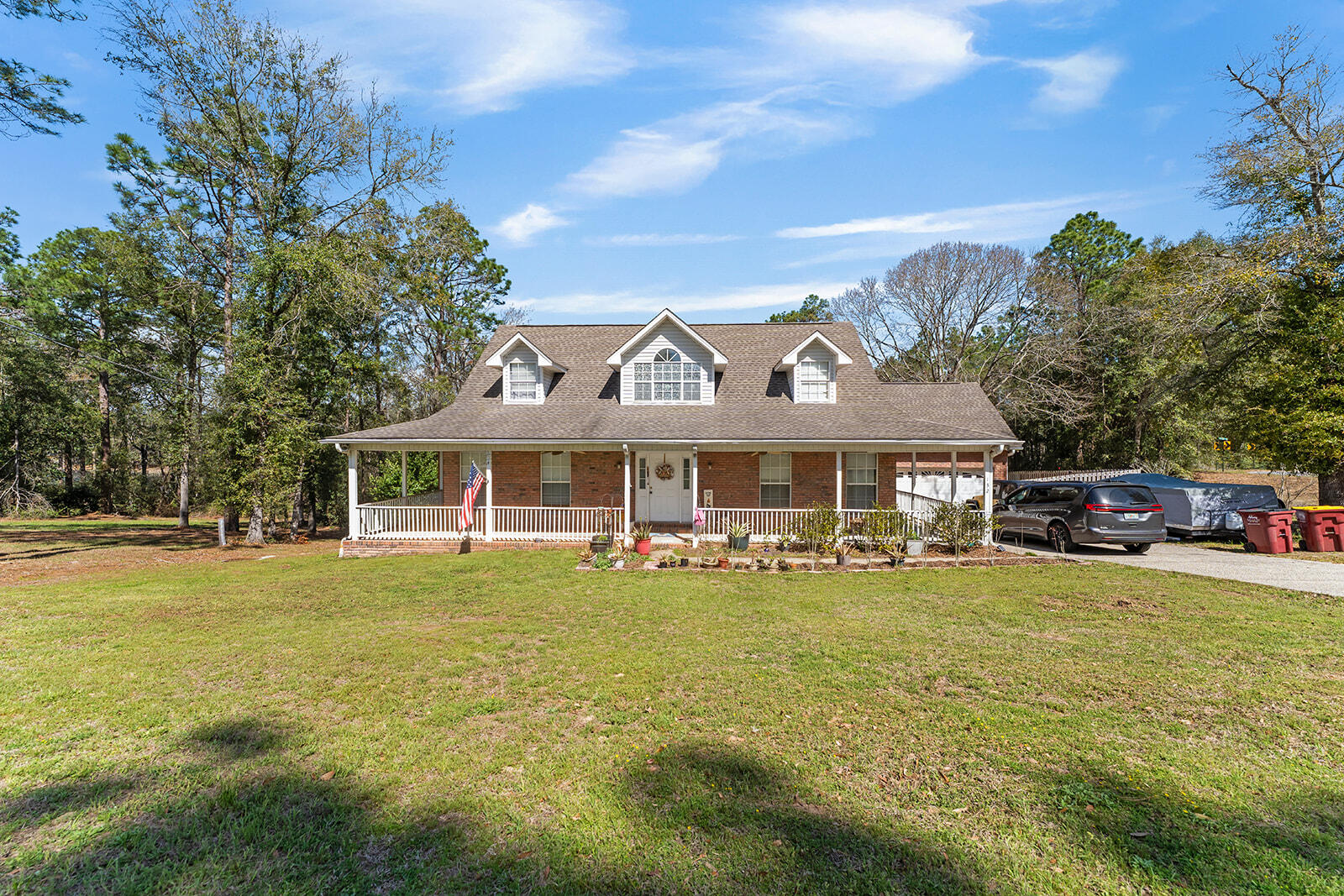 132 Wedgewood Lane Crestview, FL 32536 - Photo 7 of 67 a front view of a house with swimming pool having outdoor seating