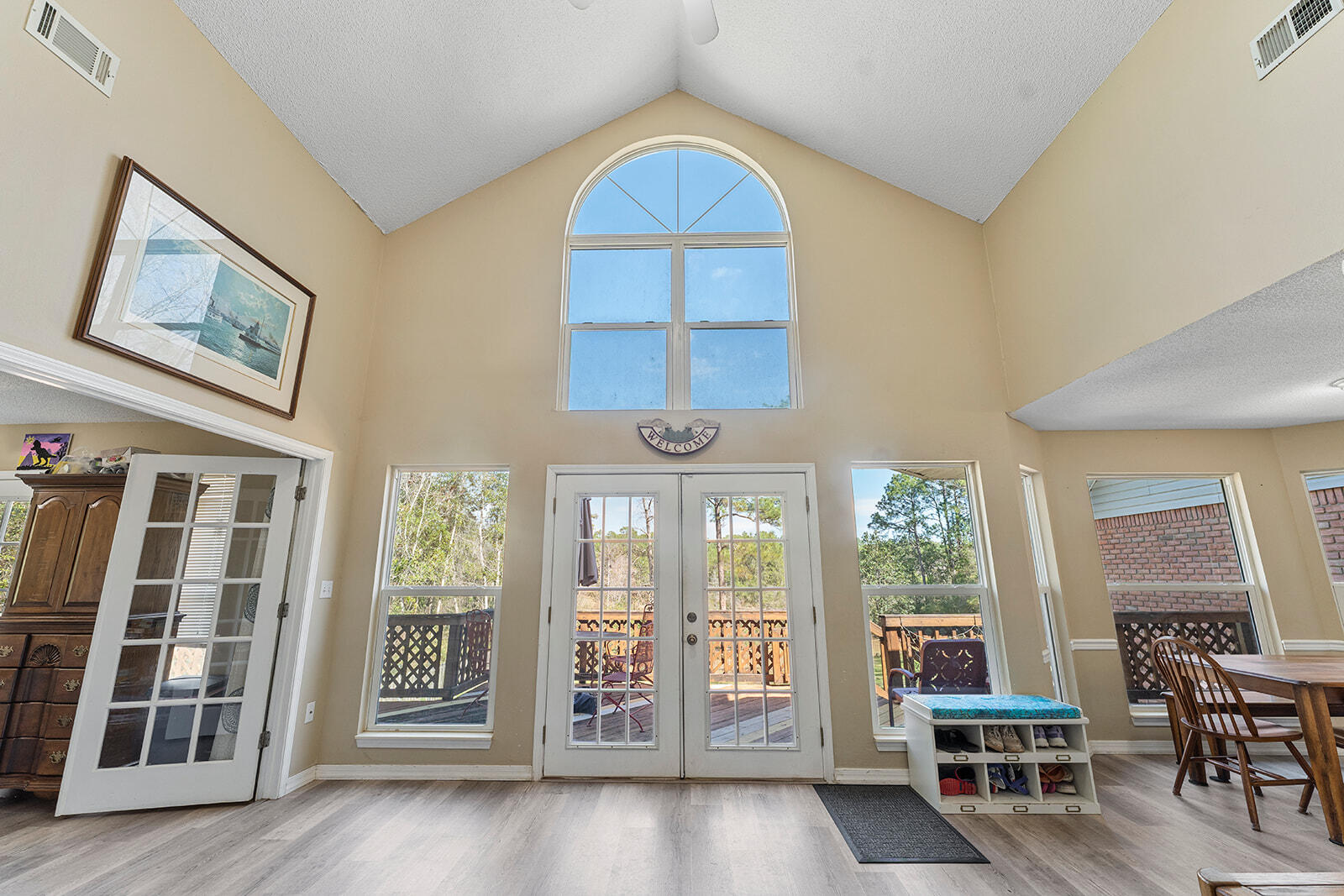 132 Wedgewood Lane Crestview, FL 32536 - Photo 8 of 67 a living room with furniture a fireplace and a large window