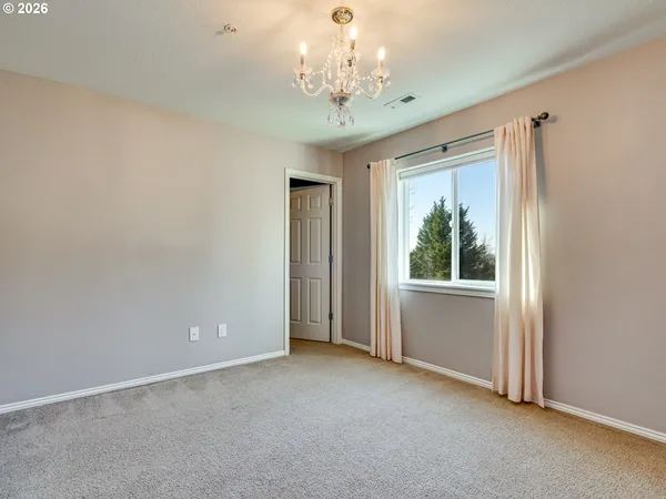 a view of a chandelier in big room and chandelier