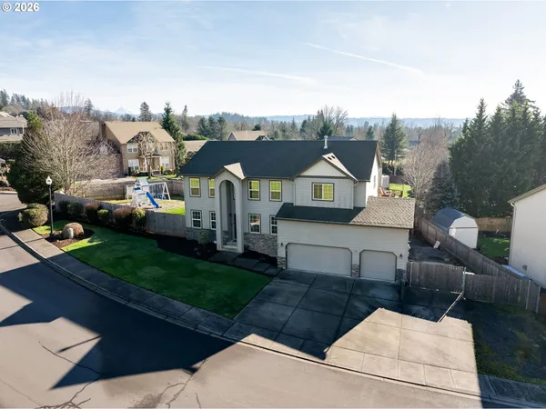 a view of multiple houses with a yard