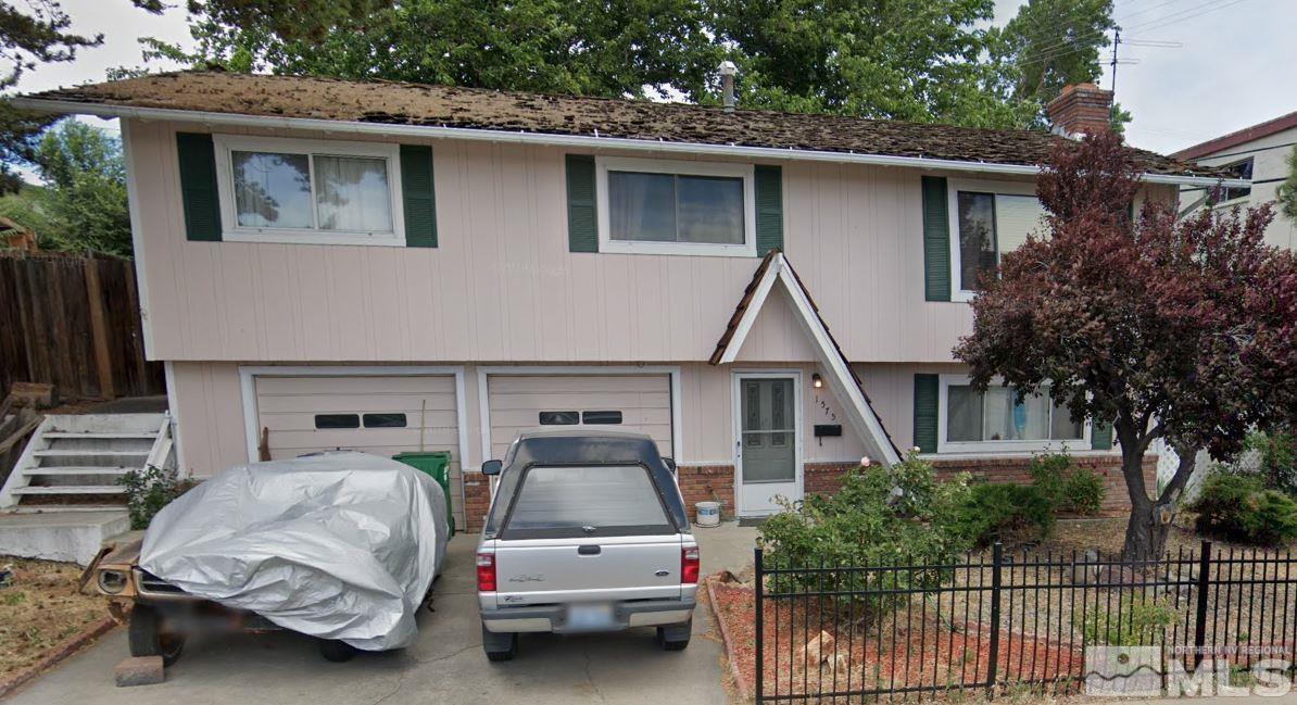 1575 Carlin Street Reno, NV 89503 - Photo 1 of 17 a couple of cars parked in front of a house