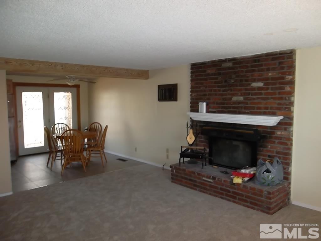1575 Carlin Street Reno, NV 89503 - Photo 13 of 17 a living room with furniture and a fireplace