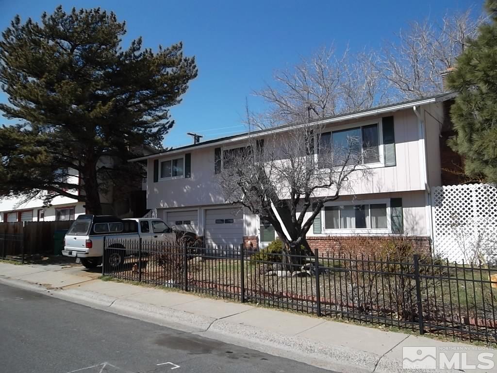 1575 Carlin Street Reno, NV 89503 - Photo 2 of 17 a front view of a house with a glass door