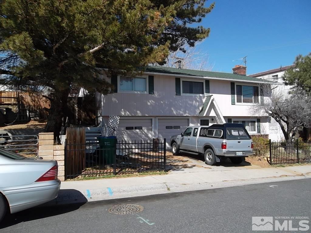 1575 Carlin Street Reno, NV 89503 - Photo 4 of 17 a front view of a house with a patio