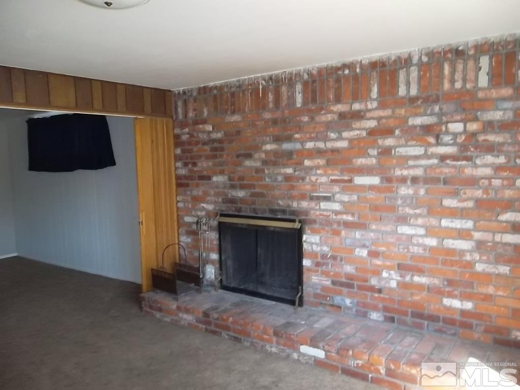 1575 Carlin Street Reno, NV 89503 - Photo 6 of 17 a living room with a fireplace