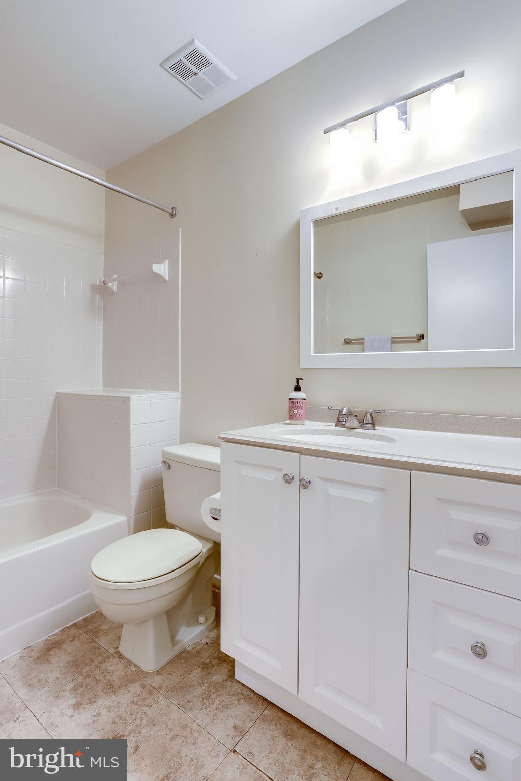 11027 Villaridge Court Reston, VA 20191 - Photo 23 of 28 a bathroom with a sink toilet vanity and mirror