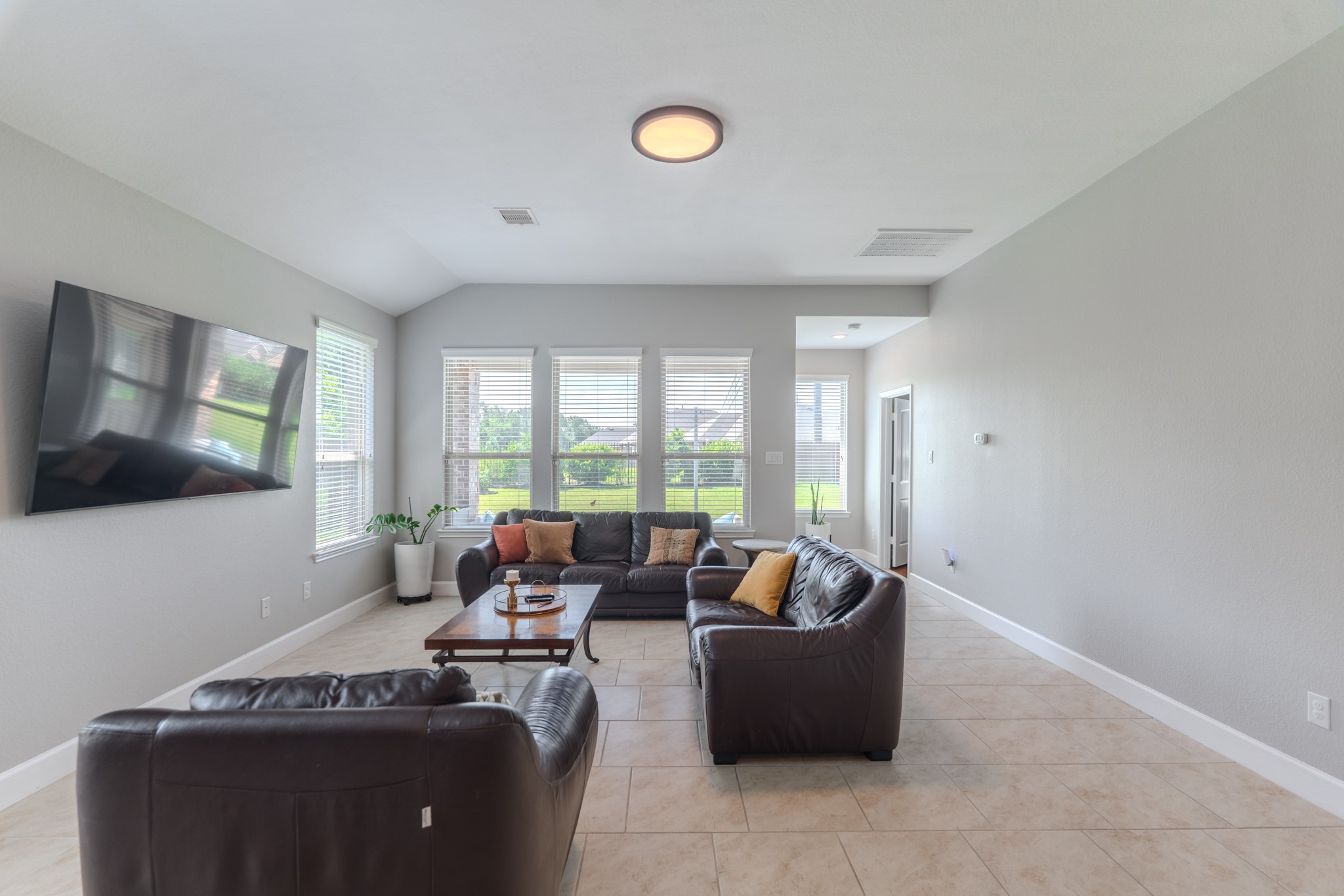 24322 North Newcastle Bay Trail Spring, TX 77389 - Photo 25 of 50 a living room with furniture and a flat screen tv