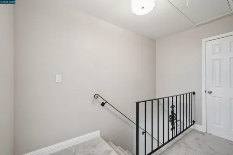 a view of a hallway with staircase