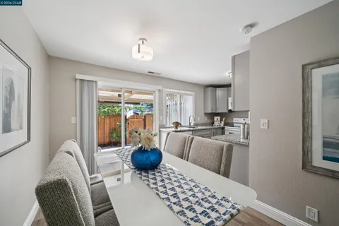a view of a dining room with furniture window and outside view