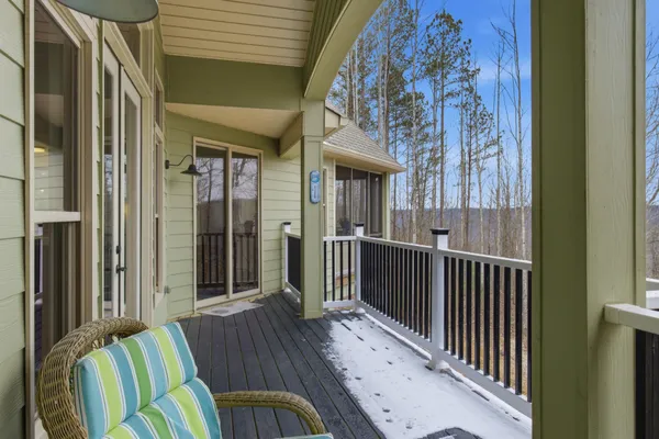 a view of a balcony with furniture