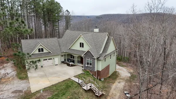 a aerial view of a house with a yard
