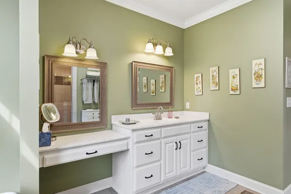 a bathroom with a double vanity sink and a mirror