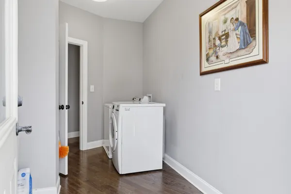 a utility room with sink dryer and washer