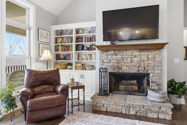 a living room with furniture and a fireplace