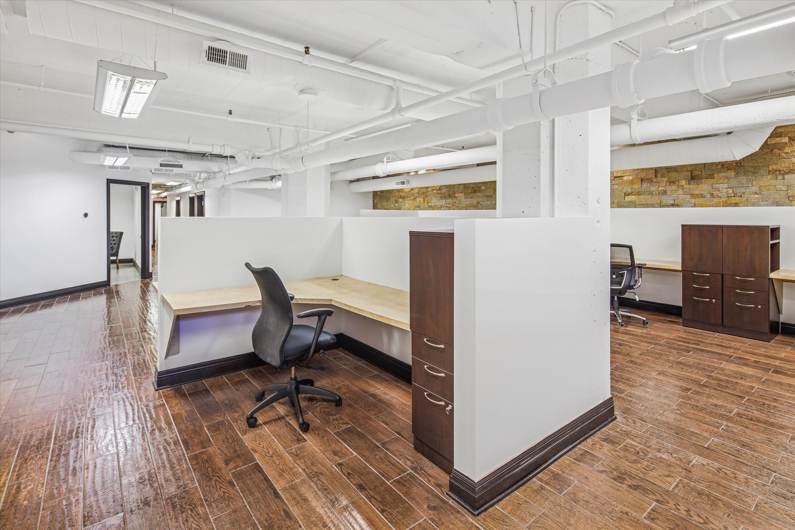 1327 West Washington Boulevard, Unit 105 Chicago, IL 60607 - Photo 12 of 16 a workspace room with furniture and wooden floor
