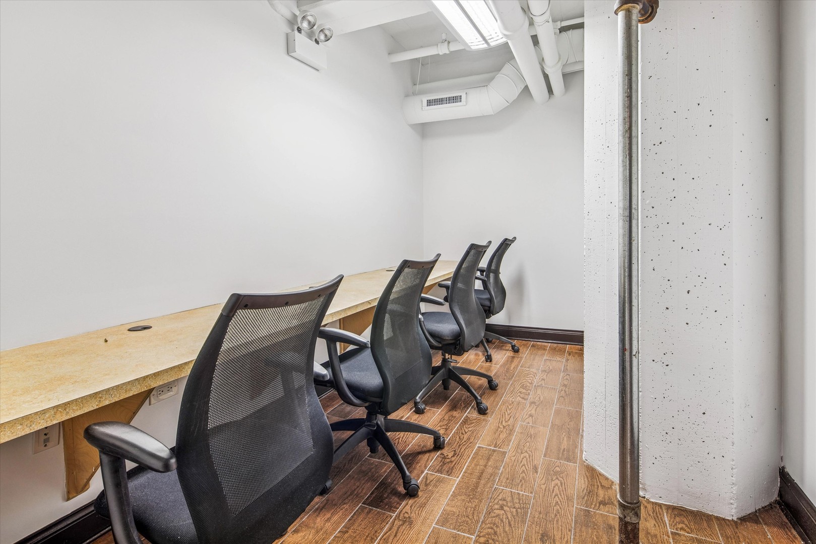 1327 West Washington Boulevard, Unit 105 Chicago, IL 60607 - Photo 6 of 16 a view of a workspace with furniture and wooden floor